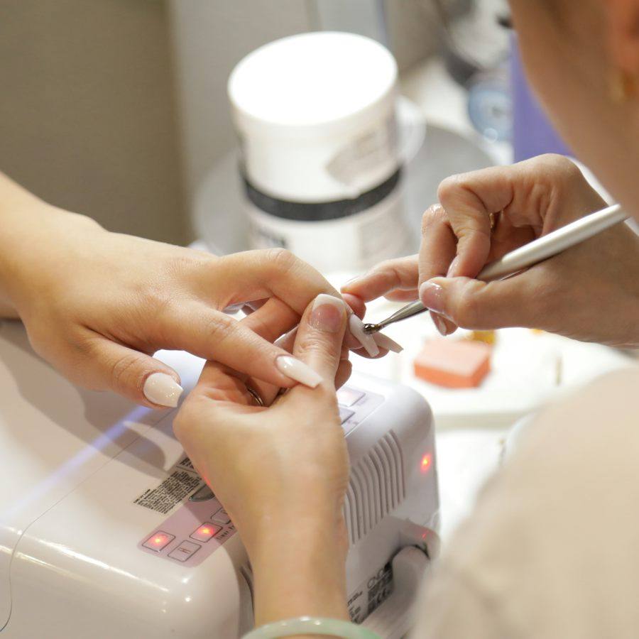 Manicurist working at the table